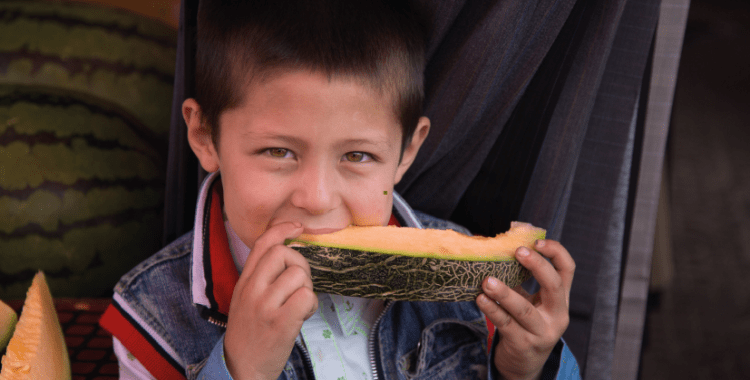 Boy with melon.